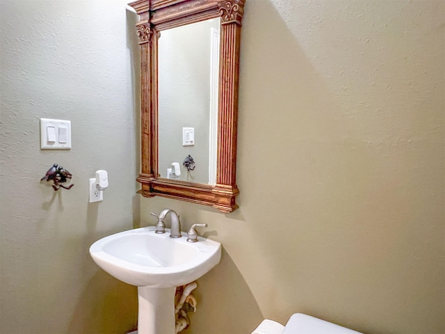 bathroom featuring toilet