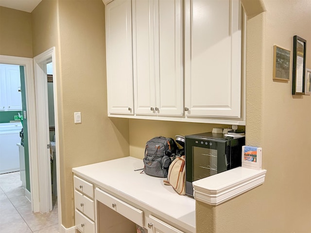 interior space featuring washer / dryer and light tile patterned flooring