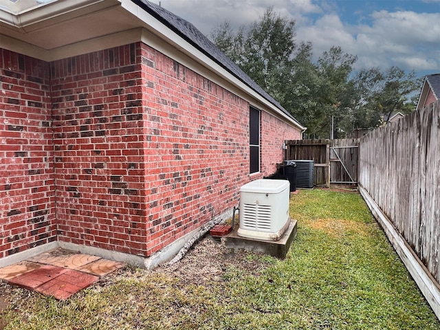 view of side of home with a lawn