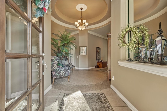 interior space featuring crown molding, a raised ceiling, a notable chandelier, and light tile patterned flooring