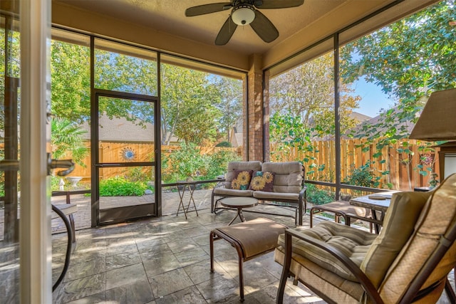 sunroom / solarium with ceiling fan