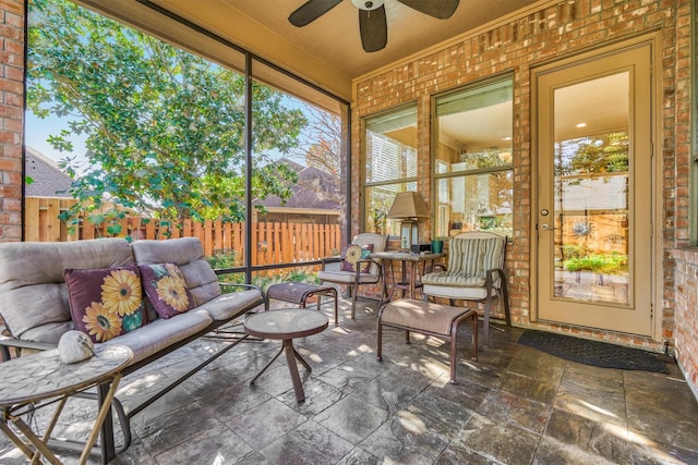 sunroom / solarium with ceiling fan and plenty of natural light