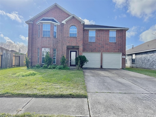 view of property featuring a garage and a front lawn