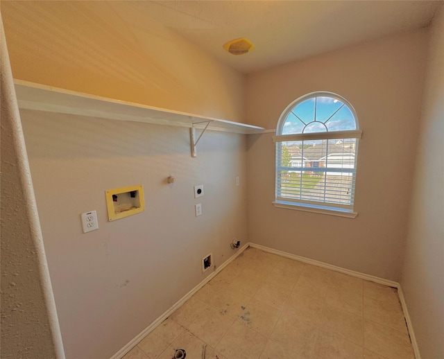 clothes washing area featuring hookup for an electric dryer, washer hookup, and gas dryer hookup