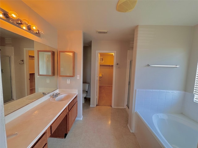 full bathroom with tile patterned floors, vanity, toilet, and plus walk in shower