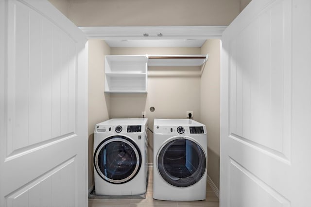 washroom featuring washer and dryer