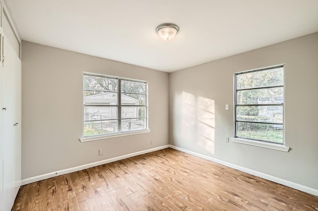 spare room featuring light hardwood / wood-style flooring