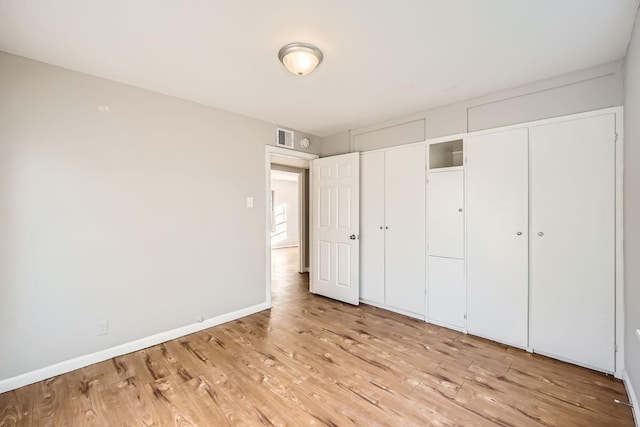 unfurnished bedroom featuring light hardwood / wood-style floors