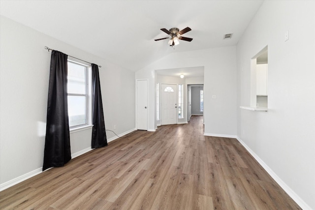 unfurnished room with light hardwood / wood-style floors, a wealth of natural light, and ceiling fan