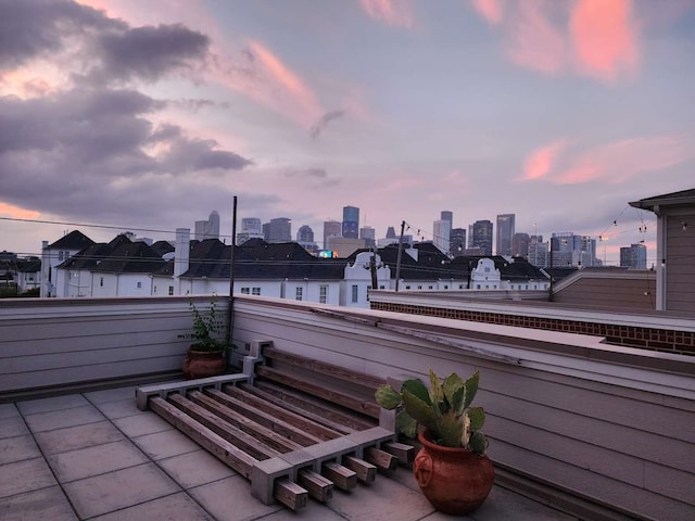 patio terrace at dusk with a balcony