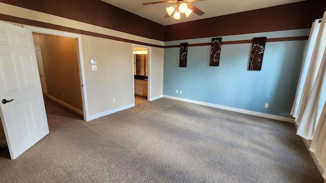 unfurnished bedroom with ensuite bathroom, carpet, and ceiling fan