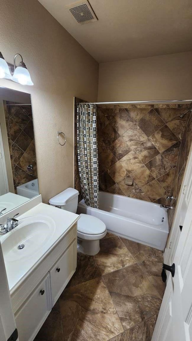 full bathroom featuring shower / bathtub combination with curtain, vanity, and toilet