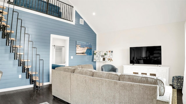 living room featuring high vaulted ceiling and dark wood-type flooring