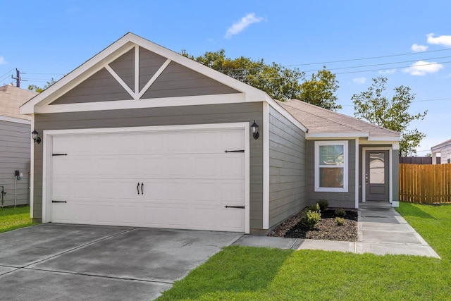 view of front of home with a garage and a front lawn