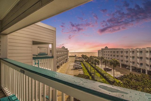 view of balcony at dusk