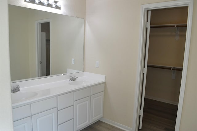 bathroom with vanity and hardwood / wood-style flooring