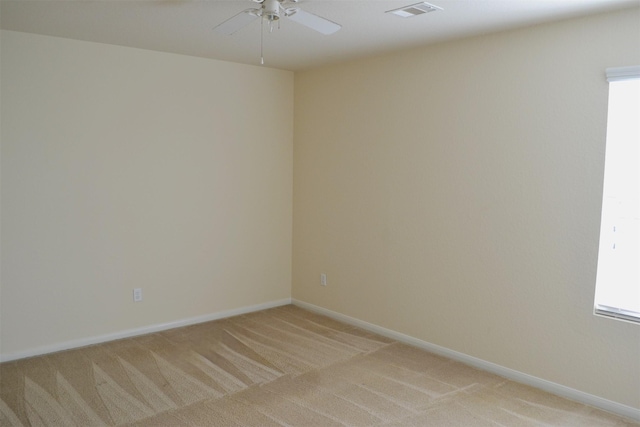 empty room with light colored carpet