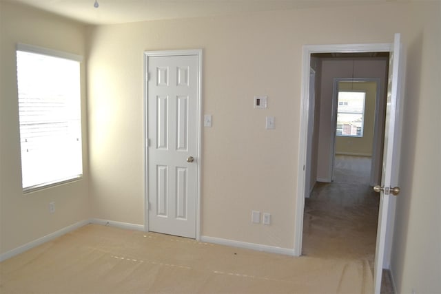 unfurnished bedroom featuring carpet flooring