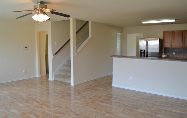 kitchen with decorative backsplash, ceiling fan, and stainless steel refrigerator with ice dispenser