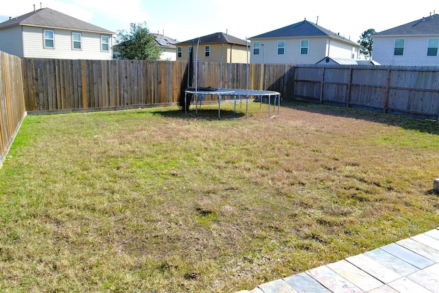 view of yard featuring a trampoline