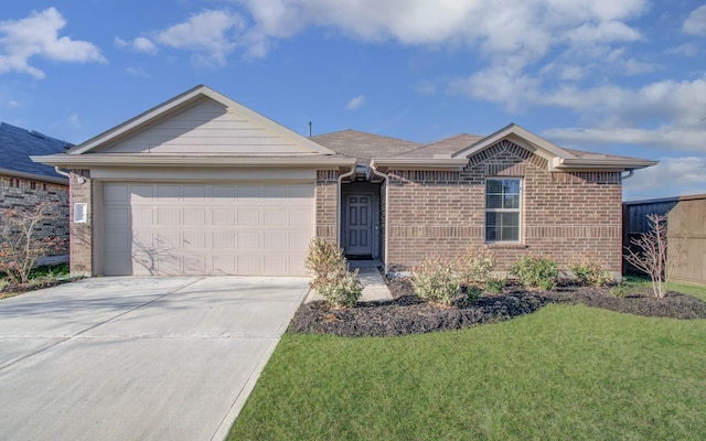 ranch-style home with a garage and a front lawn