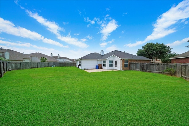 rear view of house with a yard