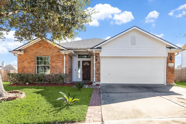 ranch-style house featuring a front yard and a garage