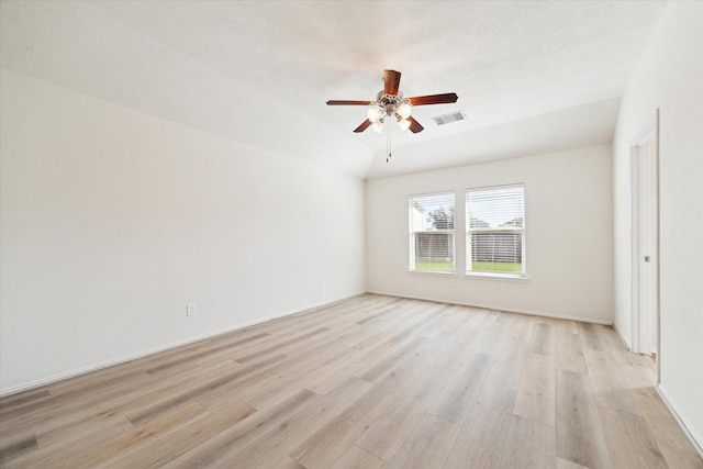 empty room featuring ceiling fan and light hardwood / wood-style floors