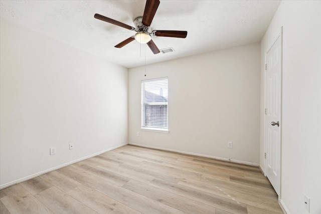 unfurnished room featuring ceiling fan and light hardwood / wood-style flooring