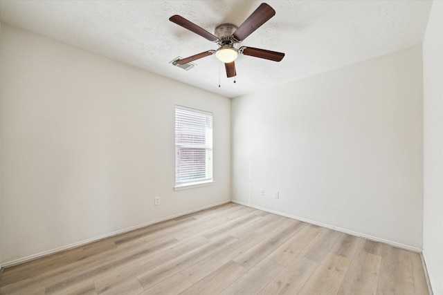 unfurnished room featuring light wood-type flooring and ceiling fan