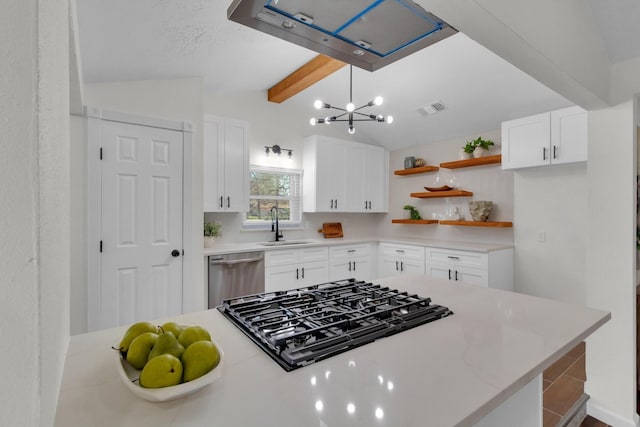 kitchen featuring gas stovetop, vaulted ceiling with beams, stainless steel dishwasher, decorative light fixtures, and white cabinets