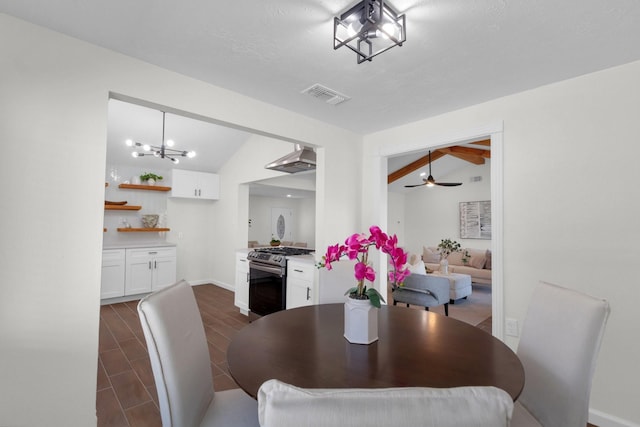 dining room with ceiling fan with notable chandelier and vaulted ceiling with beams