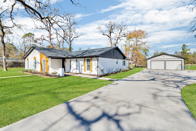 view of front of home with a front lawn and an outdoor structure