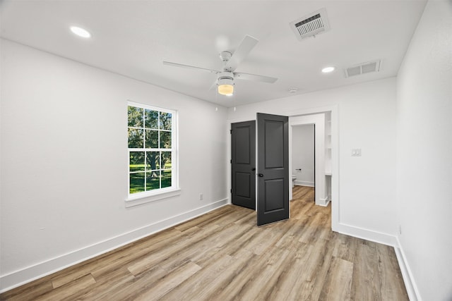 unfurnished bedroom featuring light wood-type flooring and ceiling fan