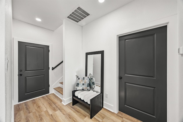 foyer entrance with light hardwood / wood-style flooring