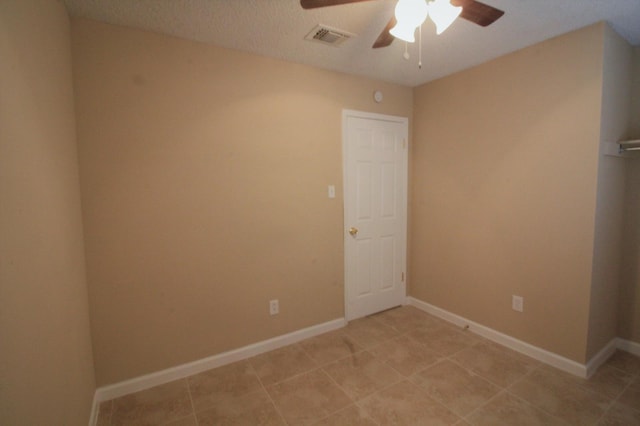 empty room featuring ceiling fan