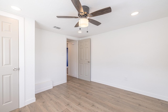 unfurnished room featuring ceiling fan and light hardwood / wood-style floors