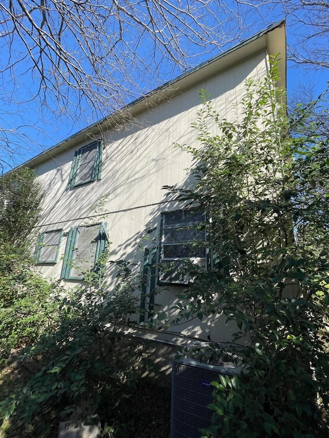 view of side of home featuring central air condition unit