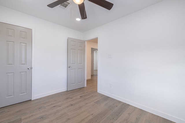 unfurnished bedroom with light wood-type flooring and ceiling fan