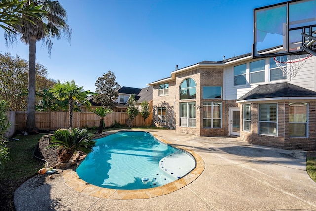 view of swimming pool with a patio area