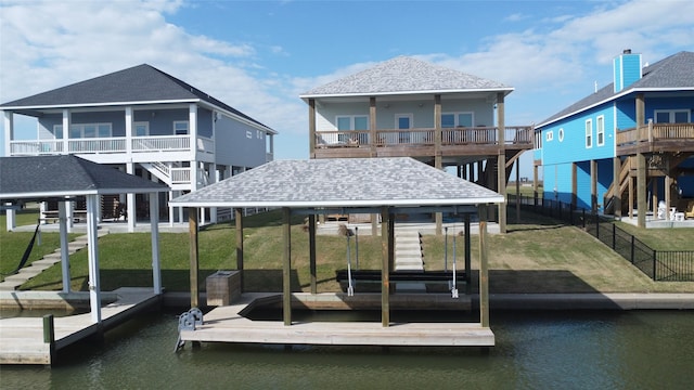 dock area featuring a yard and a water view