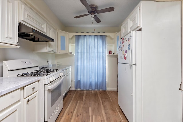 kitchen featuring white appliances, ceiling fan, exhaust hood, white cabinets, and light hardwood / wood-style floors