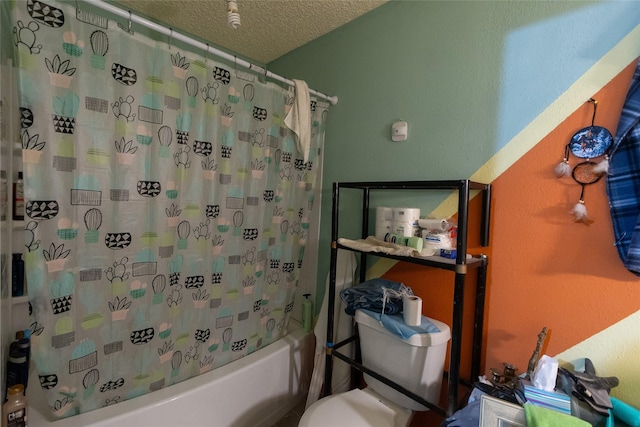 bathroom featuring a textured ceiling, shower / tub combo, and toilet