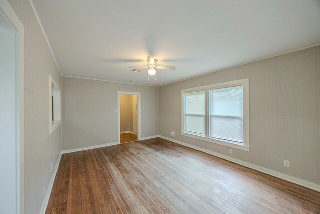 1202 14th Ave N, Texas City, TX 77590 - spare room with hardwood / wood-style flooring, ceiling fan, and ornamental molding