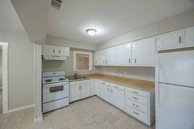 1202 14th Ave N, Texas City, TX 77590 - kitchen with sink, white cabinets, light tile patterned flooring, and white appliances