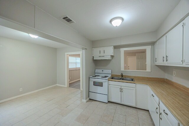1202 14th Ave N, Texas City, TX 77590 - kitchen with sink, white cabinets, and white electric stove
