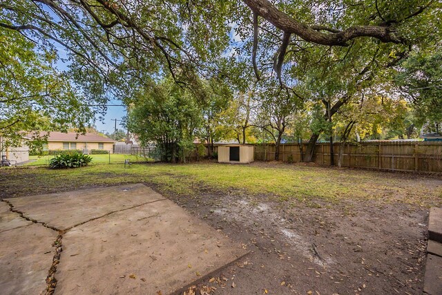 1202 14th Ave N, Texas City, TX 77590 - view of yard with a storage shed and a patio