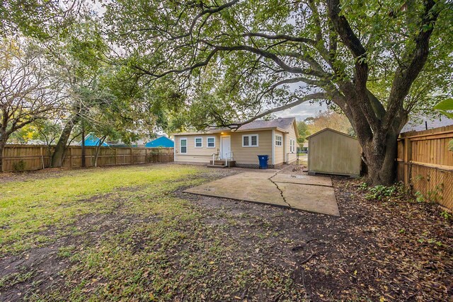 1202 14th Ave N, Texas City, TX 77590 - view of yard with a shed and a patio area
