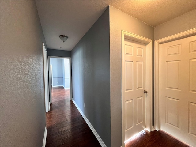 corridor featuring dark hardwood / wood-style flooring