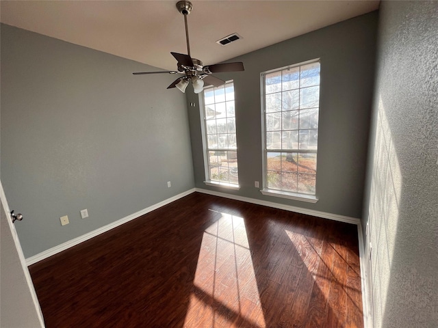 empty room with hardwood / wood-style flooring and ceiling fan